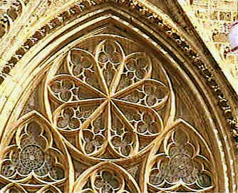 Above the main central door is a large wheel window set in decorative tracery, a common feature of French cathedrals and known asa rose window.