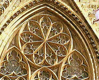 Above the main central door is a large wheel window set in decorative tracery, a common feature of French cathedrals and known asa rose window.