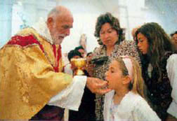Taking the holy communion - a Maronite-Cypriot girl